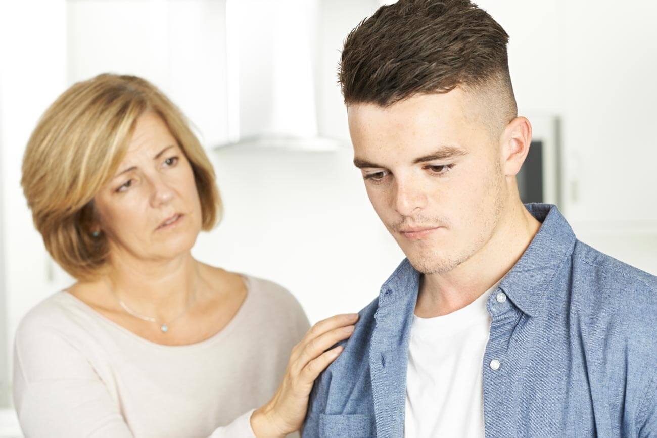 broadwaytreatmentcenter-how-to-approach-a-loved-one-who-needs-addiction-treatment-photo-of-a-mother-talking-to-her-son-about-treatment
