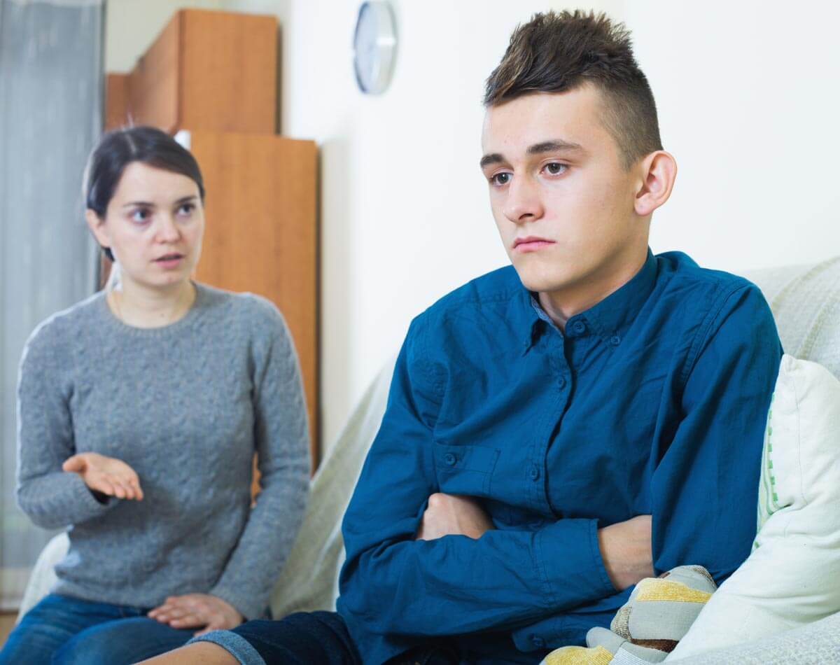 broadwaytreatmentcenter-how-to-approach-a-loved-one-who-needs-addiction-treatment-photo-of-a-serious-mother-talking-to-her-son