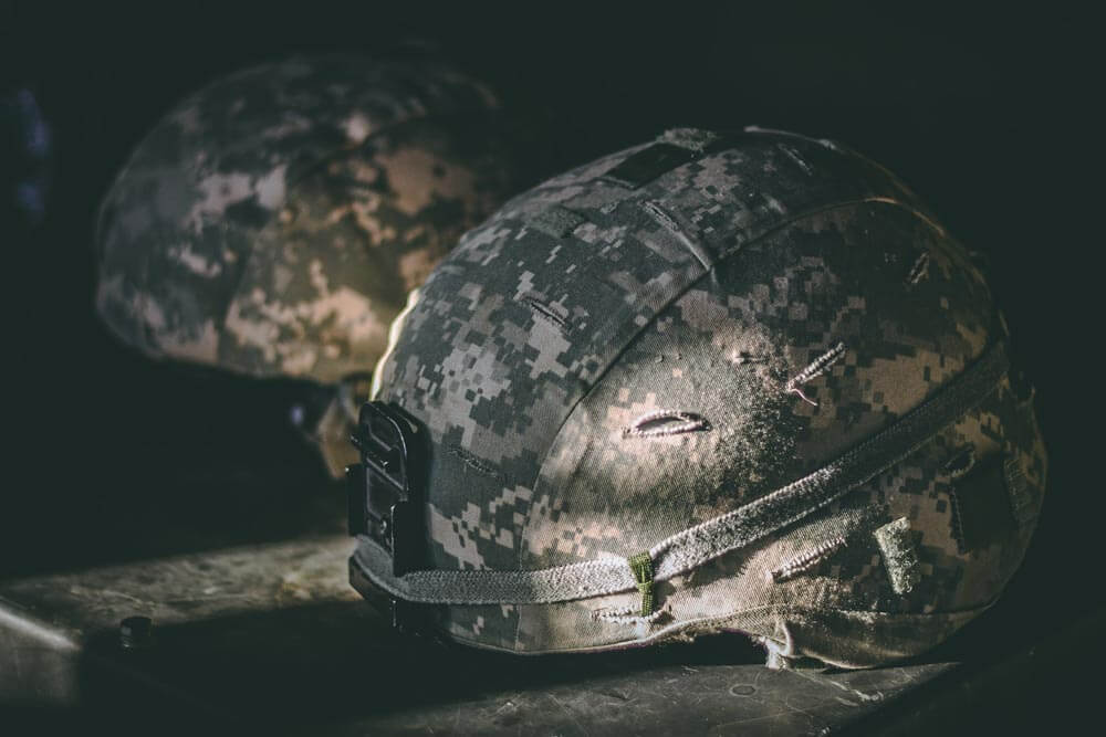 broadwaytreatmentcenter-opioid-use-in-the-us-military-photo-of-gray-and-brown-camouflage-nutshell-helmet-on-table